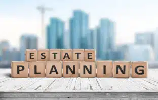 Estate Planning with Minor Children: Four Things Parents Should Know estate planning with minor children - scrabble blocks in front of a blurred city backdrop
